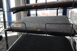 Hylde med dørmåtter