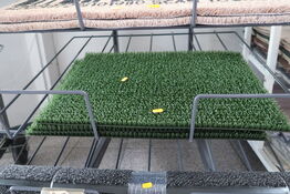 Hylde med dørmåtter