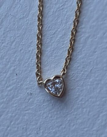 Halskæde af 14 kt. guld med brillantslebene laboratorieskabte diamant på samlet ca. 0.10 ct