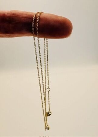 Halskæde af 14 kt. guld med brillantslebene laboratorieskabte diamant på samlet ca. 0.10 ct