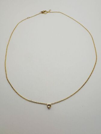 Halskæde af 14 kt. guld med brillantslebene laboratorieskabte diamant på samlet ca. 0.10 ct