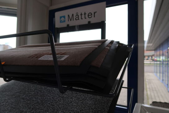 Hylde med dørmåtter