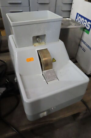 Slibemaskine til brilleglas