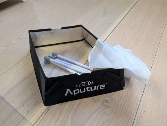 Amaran LED Tri-8C light kit, including panel, batteries, mounting gear, and carrying bag - APUTURE