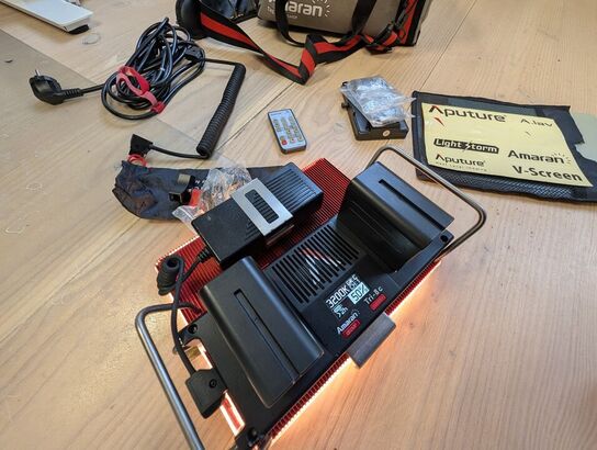 Amaran LED Tri-8C light kit, including panel, batteries, mounting gear, and carrying bag - APUTURE